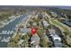Scenic aerial view of a waterfront community featuring a marina, golf course, and beautiful homes near the waterway at 409 Yacht Harbor Ct # 409, Isle of Palms, SC 29451