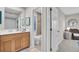 This bathroom features double sinks and a tiled shower behind a door at 409 Yacht Harbor Ct # 409, Isle of Palms, SC 29451