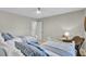 This bedroom features two twin beds, light neutral paint and a ceiling fan at 409 Yacht Harbor Ct # 409, Isle of Palms, SC 29451