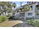 A back yard and exterior featuring trees and shrubs at 409 Yacht Harbor Ct # 409, Isle of Palms, SC 29451