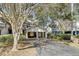 Exterior view of a two-car garage surrounded by lush greenery at 409 Yacht Harbor Ct # 409, Isle of Palms, SC 29451