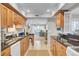 Open-concept kitchen with granite counters and modern appliances opens to the living room at 409 Yacht Harbor Ct # 409, Isle of Palms, SC 29451