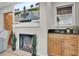 Cozy living room with a fireplace, bar area and ample natural light at 409 Yacht Harbor Ct # 409, Isle of Palms, SC 29451