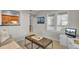 Bright living room featuring hardwood floors, stylish decor, and an open kitchen view at 409 Yacht Harbor Ct # 409, Isle of Palms, SC 29451
