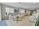 Spacious living room featuring plush seating, a glass coffee table, and lots of natural light at 409 Yacht Harbor Ct # 409, Isle of Palms, SC 29451