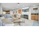 Open living space with fireplace, dining area, and comfortable seating for entertaining at 409 Yacht Harbor Ct # 409, Isle of Palms, SC 29451
