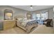 Serene bedroom with sliding glass doors leading to a deck with outdoor furniture at 409 Yacht Harbor Ct # 409, Isle of Palms, SC 29451