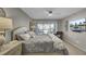 Cozy main bedroom with a comfortable queen bed, ceiling fan, and sliding glass doors at 409 Yacht Harbor Ct # 409, Isle of Palms, SC 29451