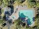 Overhead shot of a community pool, hot tub, and lounging area surrounded by lush landscaping at 409 Yacht Harbor Ct # 409, Isle of Palms, SC 29451