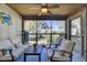 Relaxing screened porch with comfortable seating and views of the landscaped yard at 409 Yacht Harbor Ct # 409, Isle of Palms, SC 29451