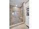 Modern tiled shower with a glass door and a built-in bench at 409 Yacht Harbor Ct # 409, Isle of Palms, SC 29451