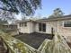 The backyard has an upper deck, a brick house, and a small bench at 4341 Helene Dr, North Charleston, SC 29418