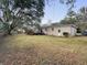 The backyard features a brick house, an upper deck, and a spacious lawn at 4341 Helene Dr, North Charleston, SC 29418