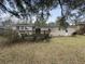 A backyard with a brick house featuring an upper deck at 4341 Helene Dr, North Charleston, SC 29418