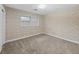 Cozy carpeted bedroom with patterned wallpaper, a window, and ample natural light at 4341 Helene Dr, North Charleston, SC 29418