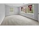 Bedroom featuring neutral carpet, large windows with decorative window treatments, and neutral paint at 4341 Helene Dr, North Charleston, SC 29418