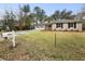 Traditional brick home with a well-kept lawn and a two-car garage at 4341 Helene Dr, North Charleston, SC 29418