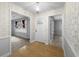Inviting hallway with hardwood floors leading to rooms with ample natural light at 4341 Helene Dr, North Charleston, SC 29418