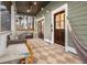 Inviting porch with comfortable seating, ceiling fan, and cozy lighting at 493 Woodland Shores Rd, Charleston, SC 29412