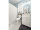 Charming bathroom with blue walls, white fixtures, and a patterned floor at 493 Woodland Shores Rd, Charleston, SC 29412