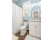 Charming bathroom with white vanity, shower with curtain, and blue wall accents at 493 Woodland Shores Rd, Charleston, SC 29412