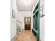 Entryway featuring a wooden door, wood floors, and built-in green lockers with hooks and storage at 493 Woodland Shores Rd, Charleston, SC 29412