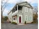 Attractive two-story home with inviting front porch and well-maintained landscaping at 493 Woodland Shores Rd, Charleston, SC 29412