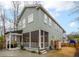 Rear exterior view of the home showcasing a screened porch and outdoor shower at 493 Woodland Shores Rd, Charleston, SC 29412