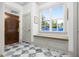 Bright foyer features beautiful tile flooring, bench seating and natural light at 493 Woodland Shores Rd, Charleston, SC 29412