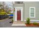 Inviting front entrance with a maroon door, exterior lighting, and manicured landscaping at 493 Woodland Shores Rd, Charleston, SC 29412