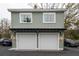 Two car garage with overhead apartment and white garage doors at 493 Woodland Shores Rd, Charleston, SC 29412