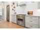 Kitchen detail with modern cabinets and drawers, chef-style oven, and view of stained glass door at 493 Woodland Shores Rd, Charleston, SC 29412