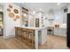 Spacious kitchen with marble countertop, stainless steel appliances, and decorative woven wall hangings at 493 Woodland Shores Rd, Charleston, SC 29412