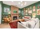 A cozy living room with a brick fireplace, built-in bookshelves, and stylish furnishings at 493 Woodland Shores Rd, Charleston, SC 29412