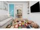 Bright living room with large colorful rug, comfortable seating, and open view to dining area at 493 Woodland Shores Rd, Charleston, SC 29412
