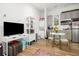 Versatile living space with modern kitchenette, workspace, and a large television at 493 Woodland Shores Rd, Charleston, SC 29412