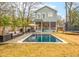 Relaxing backyard with a pool, patio furniture, and privacy fence, perfect for outdoor enjoyment at 493 Woodland Shores Rd, Charleston, SC 29412
