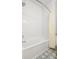 Shower tub featuring white tile surround and blue-patterned floor at 493 Woodland Shores Rd, Charleston, SC 29412