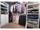 Organized walk-in closet with shelves and hanging racks providing ample storage space at 493 Woodland Shores Rd, Charleston, SC 29412