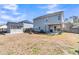 Expansive backyard view showcases a shed, pergola-covered patio, and fire pit area at 5073 Blair Rd, Summerville, SC 29483