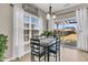 Bright dining area features a modern table, chairs, and slider door to the backyard at 5073 Blair Rd, Summerville, SC 29483