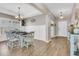 Elegant dining room with wainscoting, tray ceiling, and a chandelier at 5073 Blair Rd, Summerville, SC 29483
