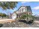 Charming two-story home featuring a welcoming front porch and lush landscaping at 5073 Blair Rd, Summerville, SC 29483