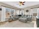 Spacious living room with a large sectional sofa, natural light, and comfortable seating at 5073 Blair Rd, Summerville, SC 29483