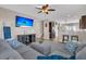 Inviting living room with an open floor plan, large sectional, and view of the kitchen at 5073 Blair Rd, Summerville, SC 29483