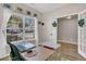 Comfortable office space with natural light, wood floors, and view into another room at 5073 Blair Rd, Summerville, SC 29483