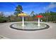 Mushroom-themed splash pad with colorful red, yellow, and blue fixtures, offering hours of fun for the Gathering at 5073 Blair Rd, Summerville, SC 29483