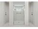 Stunning bathroom featuring three walk-in showers with elegant marble tiling and modern fixtures at 509 Seven Farms Dr, Charleston, SC 29492