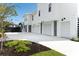 Spacious three-car garage with ample parking and landscaped surroundings at 509 Seven Farms Dr, Charleston, SC 29492