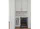Butler's pantry complete with beverage fridge and wine rack at 509 Seven Farms Dr, Charleston, SC 29492